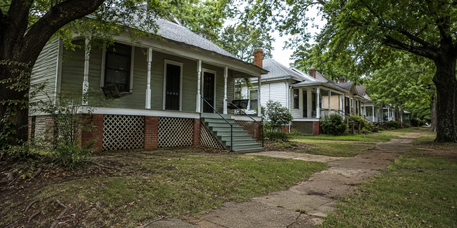 Older Huntsville homes raised on brick piers with lattice-skirted crawl spaces